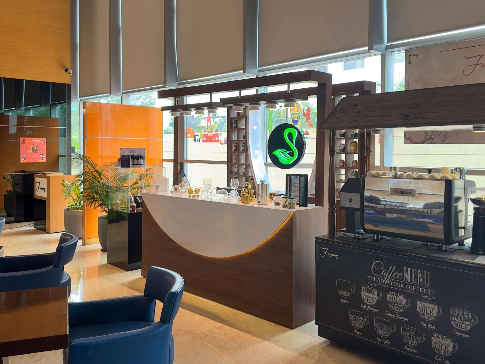 Novotel Pune Viman Nagar Road Exterior photo A Starbucks in the airport